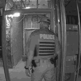 Ajax photo verification: an officer in a police vest inside the building at night