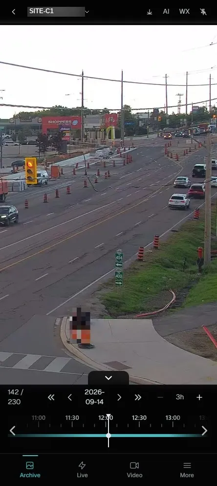 CeePlayer running on a phone, showing a road construction site with a pedestrian automatically masked for privacy